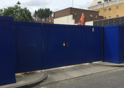 Large blue commercial fencing and gate