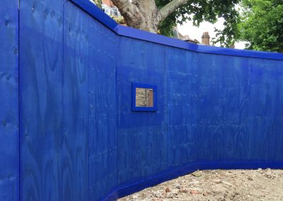 Wooden commercial fencing painted blue
