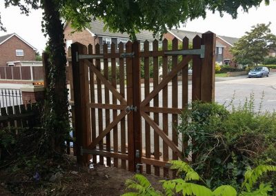 Wooden gate with bolt and latch