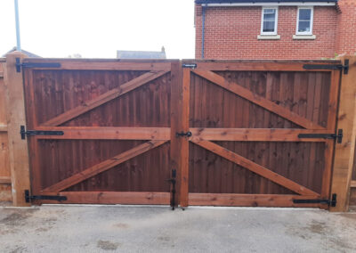 Dark wood gate for residential property