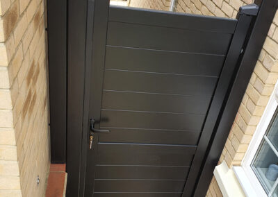 Black composite gate for residential property