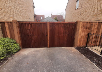 Dark wood gate for residential property