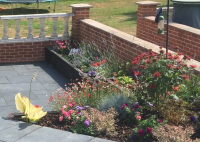 Hard landscaping with flower bed