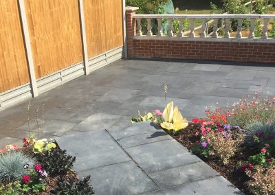 Hard landscaping with flower bed example